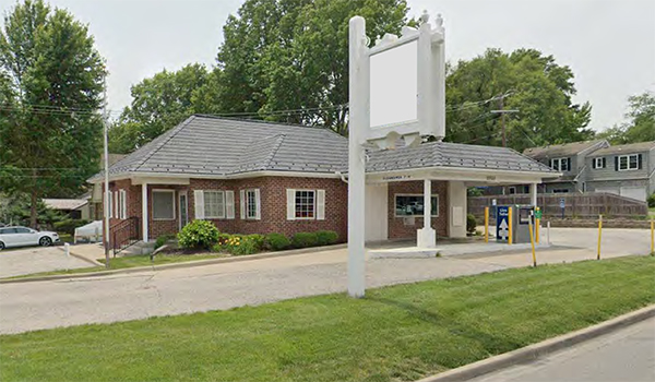 building exterior with drive through and signage